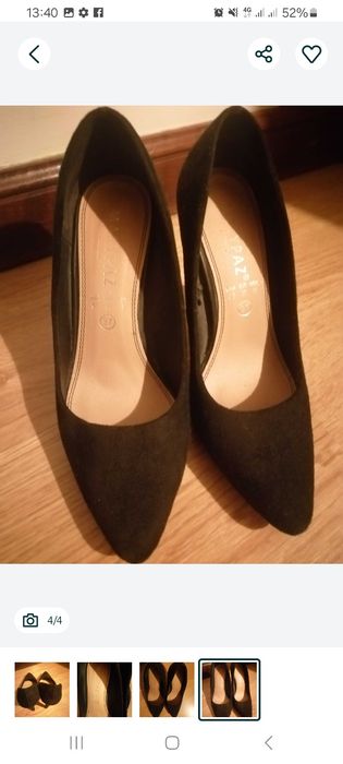 Sapatos pretos de salto alto