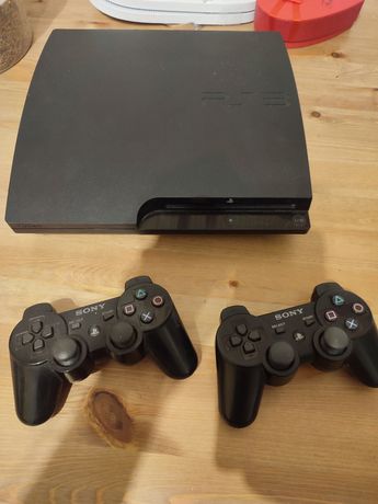 PS3 completa em caixa- 2 comandos e jogos