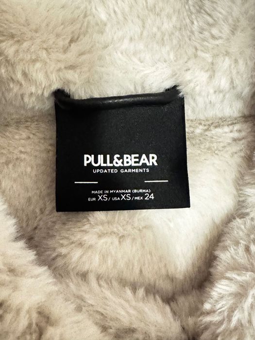 Zimowy kożuch w dobrym stanie, czarny z białym wykończeniem