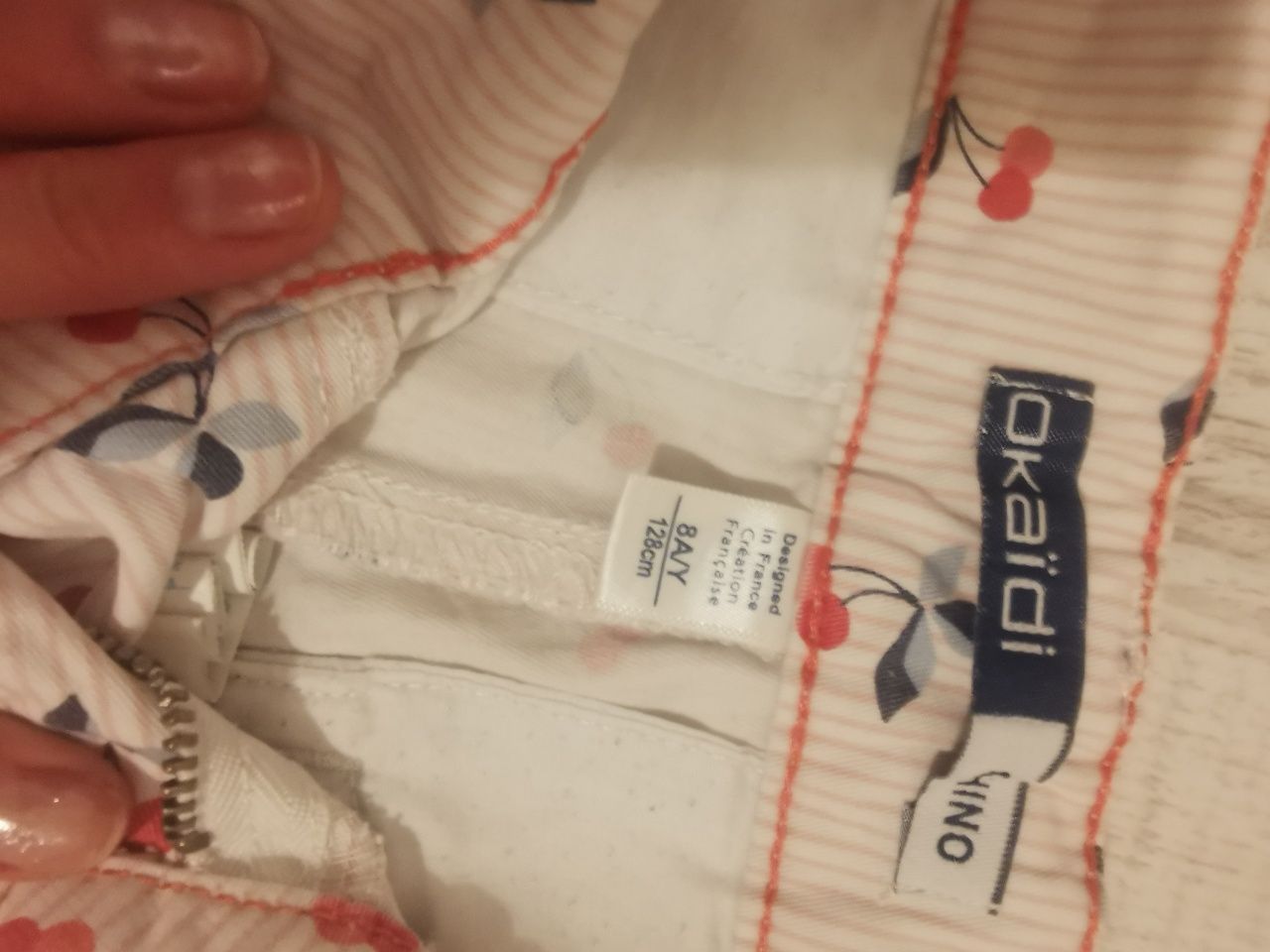 krótkie spodenki rozmiar 128 kolorowe Okaidi