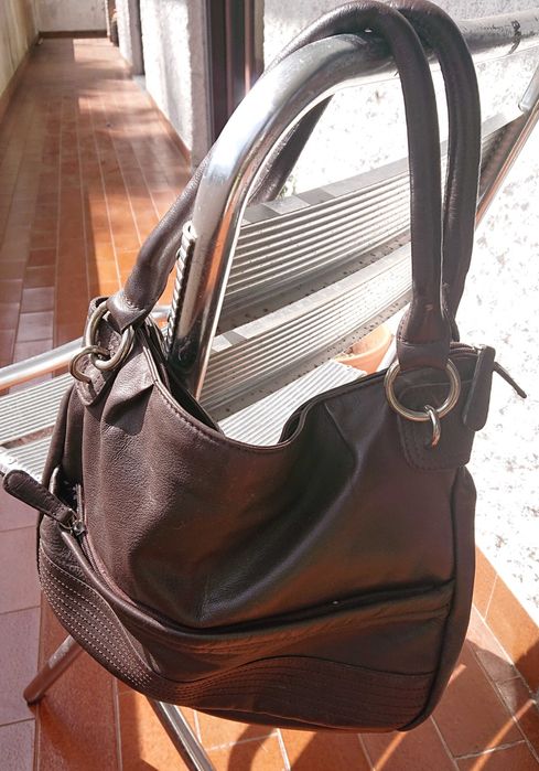 Mala castanha em pele