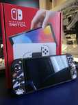 Nintendo Switch OLED (Białe) +  akcesoria i grą Pokemon (z USA i PL)