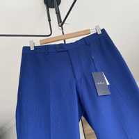 nowe metka niebieskie granatowe spodnie eleganckie garniturowe mango M