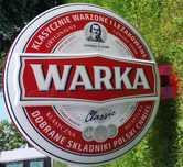 Duży neon Warka z wspornikiem