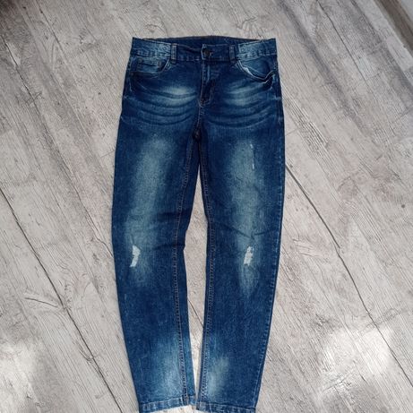 Przecierane elastyczne jeansy 158 cm