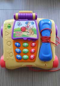 Zabawkowy telefon fisher-price.