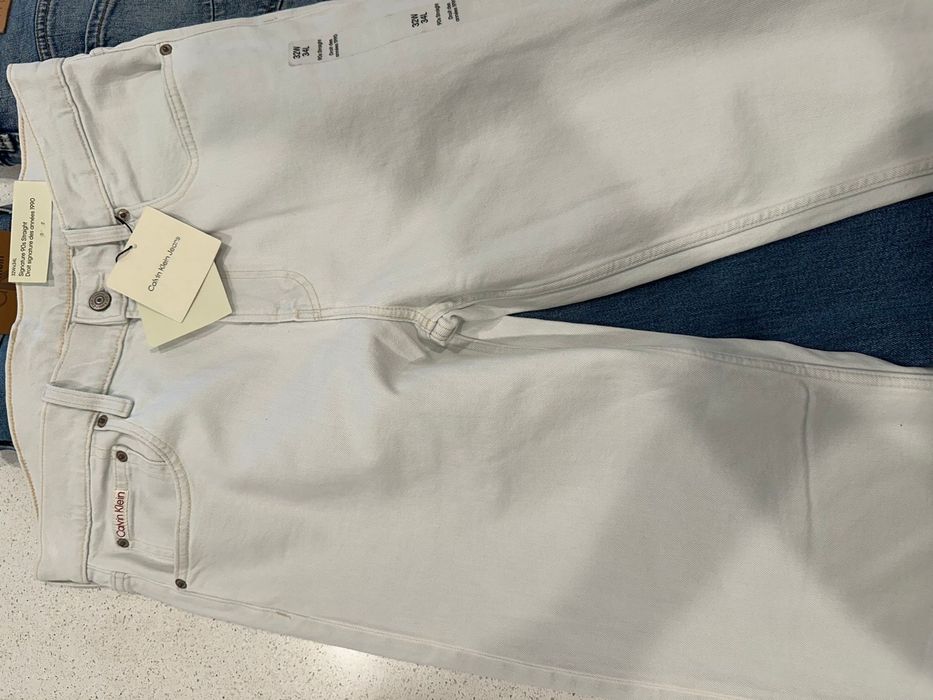Джинси Calvin Klein L  в молочному кольорі