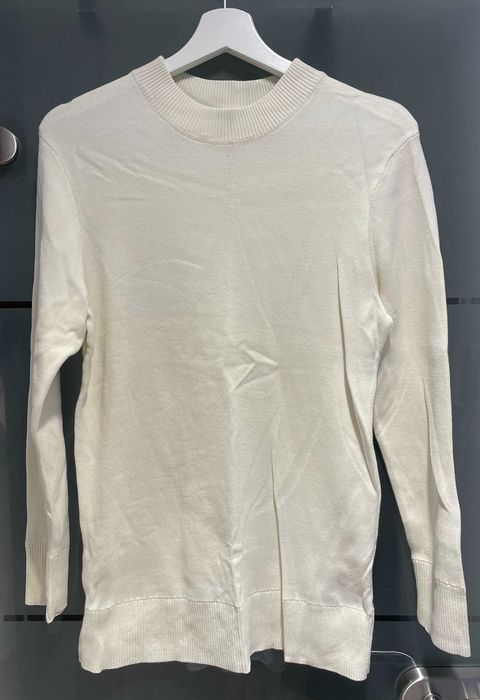 Kremowy sweter męski