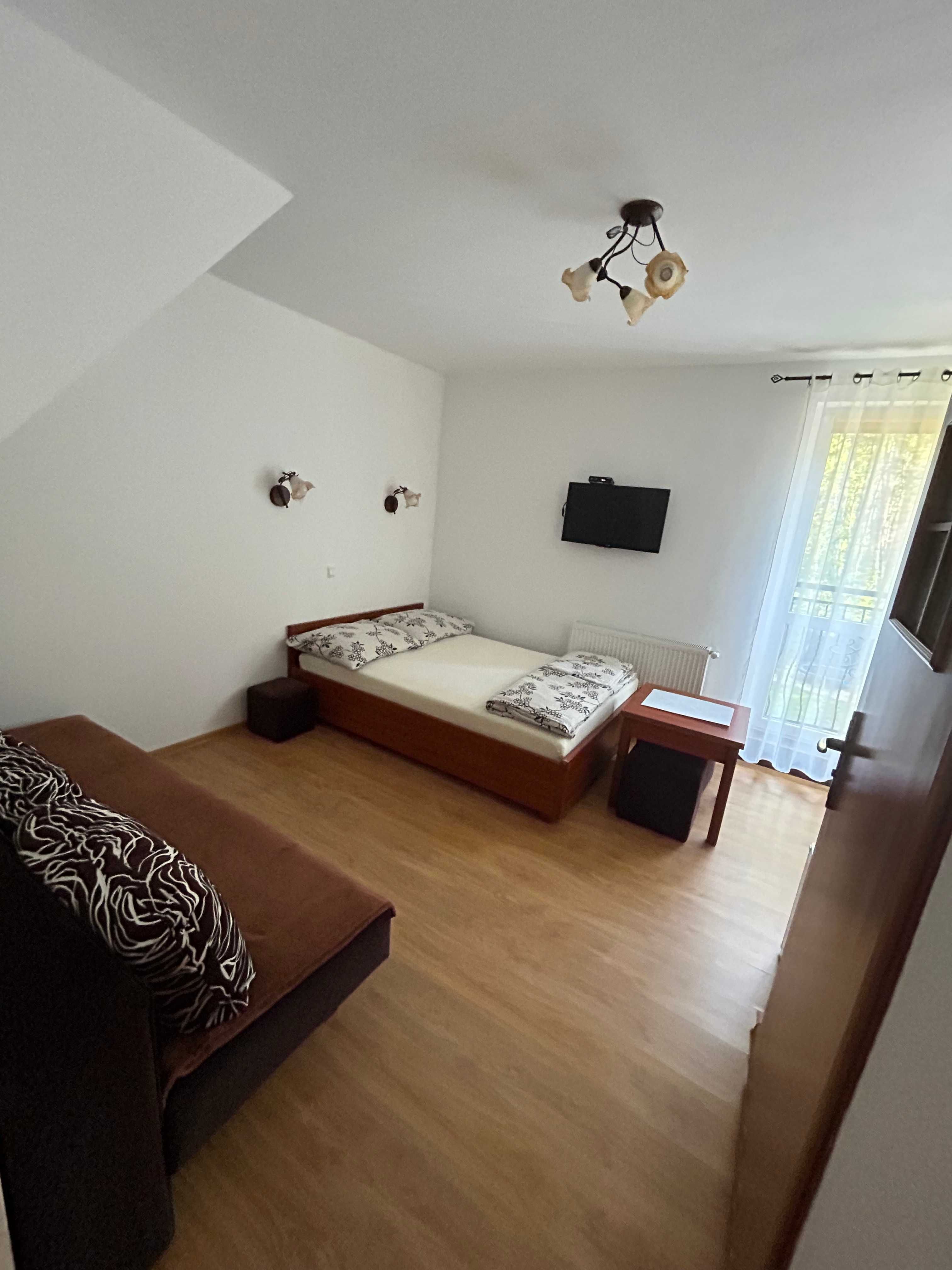 Pokoje Gościnne POD LASEM Pogorzelica