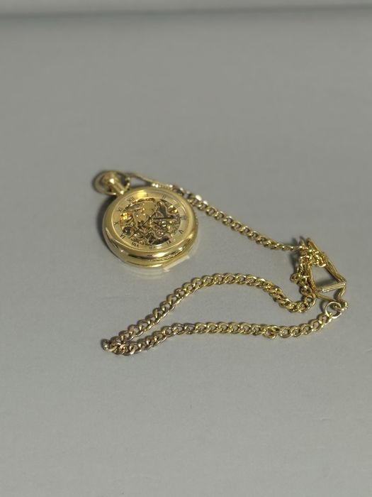 Механічний, кишеньковий годинник.