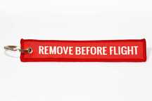 Brelok lotniczy "REMOVE BEFORE FLIGHT" – czerwony