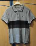Polo Nike criança cinzento