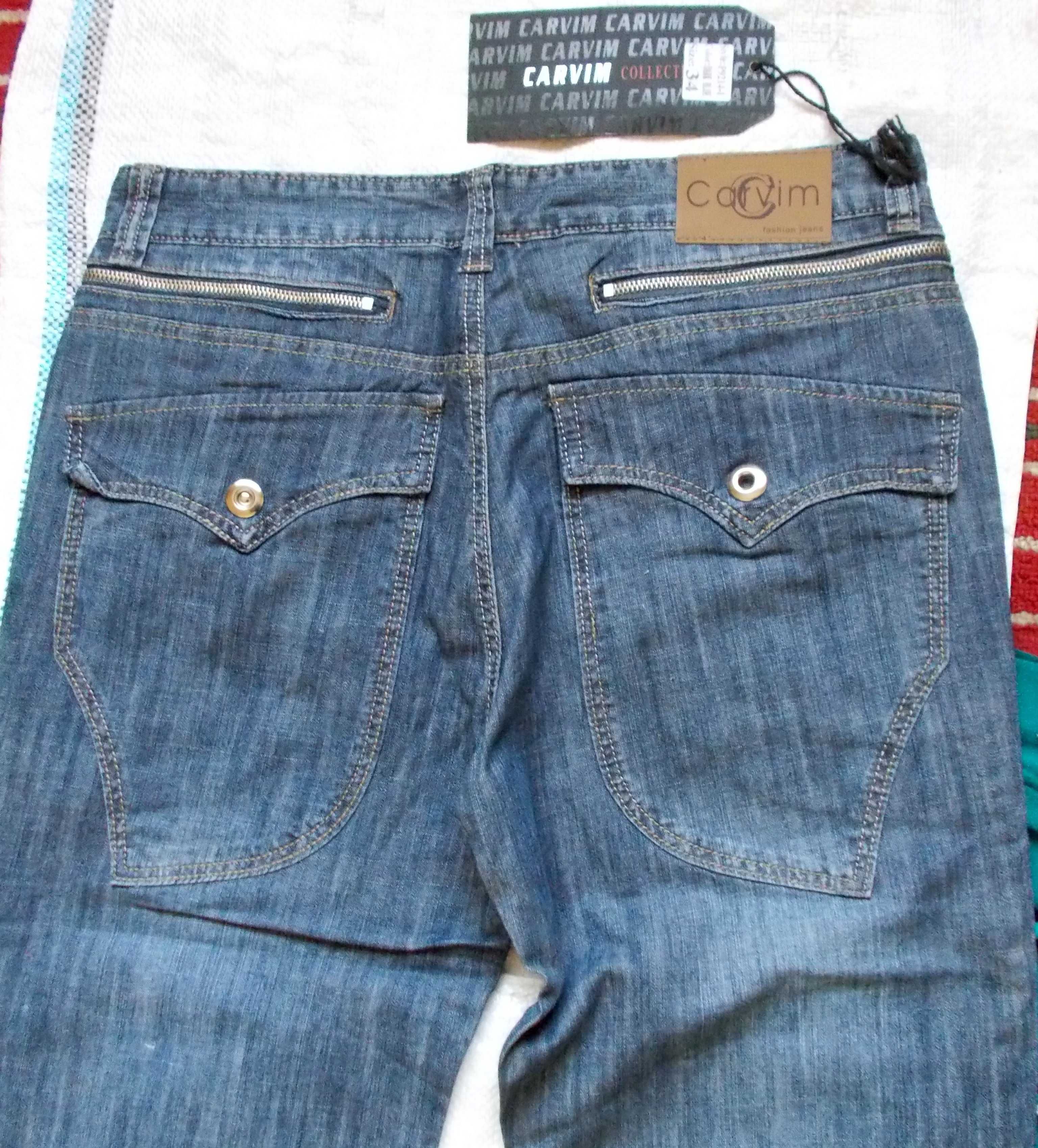 джинсы с множеством карманов,88 см.пояс.Новые