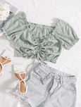 Pudrowo zielona bluzka crop top letnia ze sznurkami z przodu