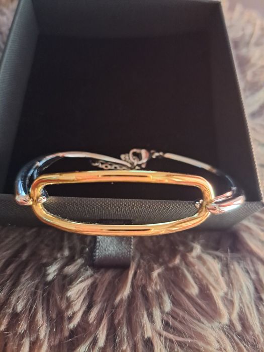 Pulseira em aço prateado e dourado