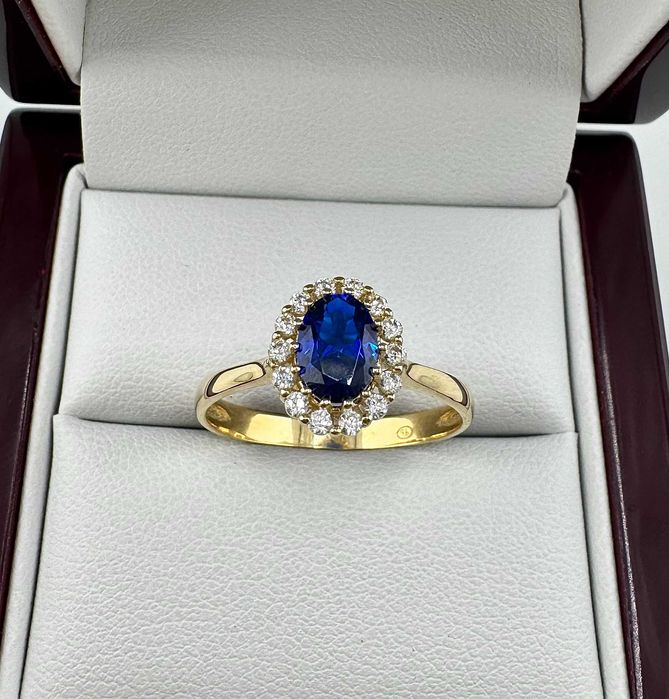 Złoty pierścionek z granatowym oczkiem 2,42g 585 14K R. 20