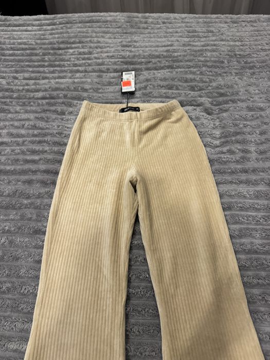 Продам нові кльошні штани в смужку !