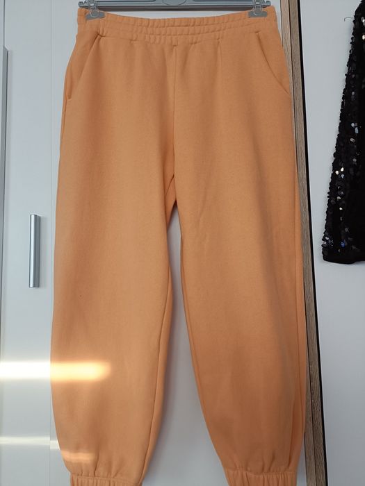 Spodnie dresowe Reserved pomarancz