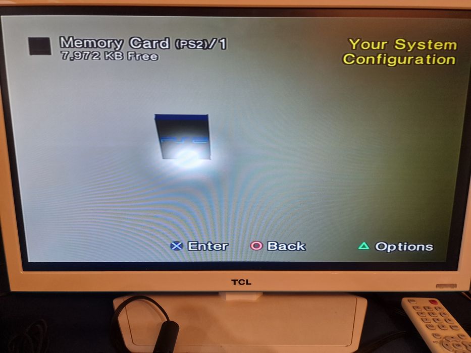 Konsola PlayStation 2 + TV TCL 24" + Gratisy-> 4 pady,  11 gier