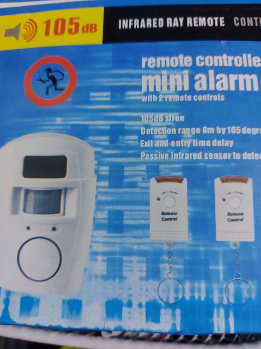 Alarm bezprzewodowy biały z 2 pilotami