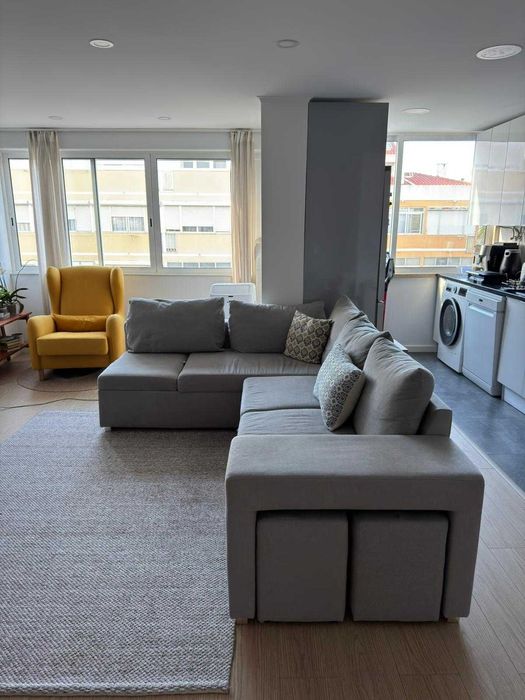 Sofá-cama cinzento de canto com chaise longue