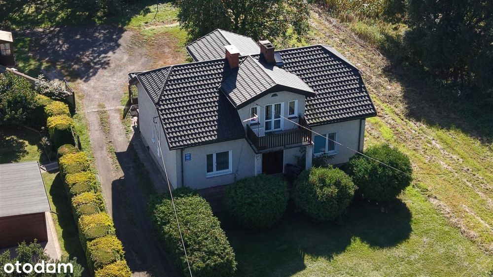 Dom z garażem i budynkiem gospodarczym