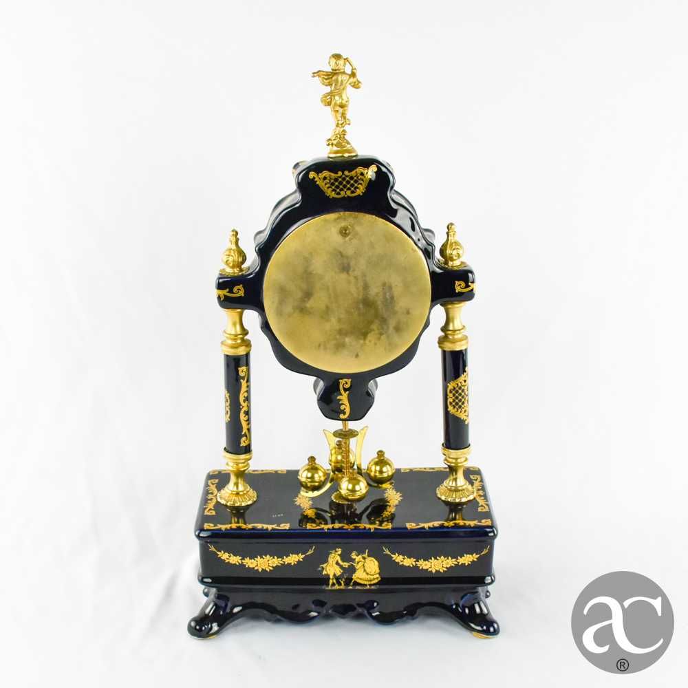 Relógio de lareira em porcelana Limoge e metal dourado
