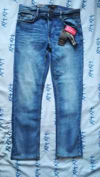 Spodnie męskie niebieskie jeansowe dżinsowe firmy  SMOG W 31 L 32.