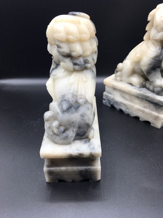 Caes foo orientais em pedra