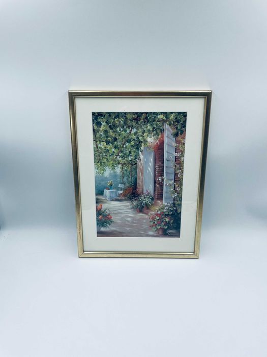 Grafika w ramce złoconej przedstawiająca wyjcie na ogród.