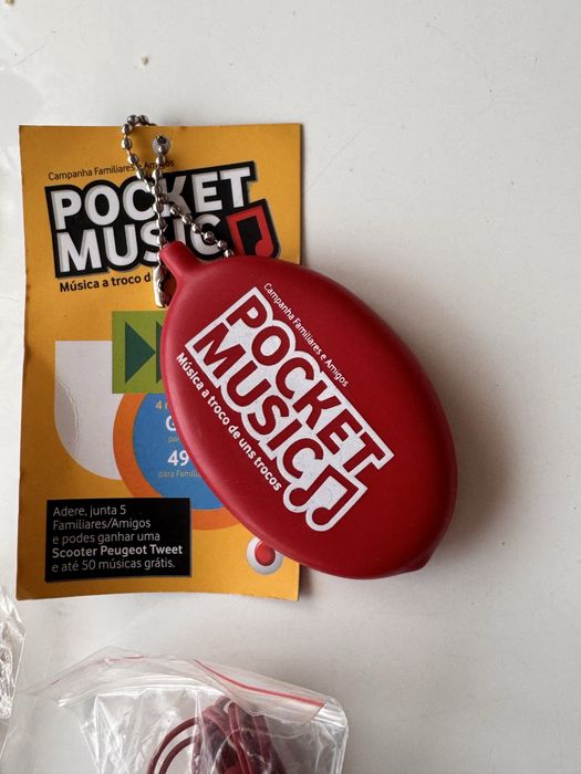 Merchandising abre capsulas coke auriculares super bock porta chaves