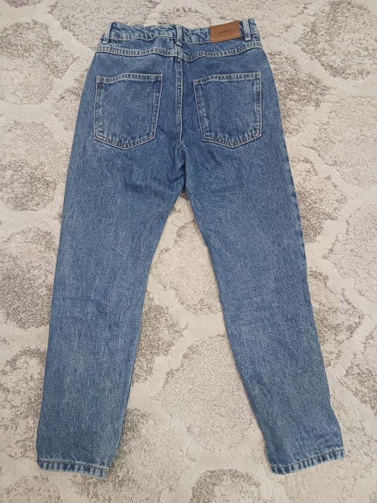 Spodnie jeans dziewczęce z dziurami roz 146 Reserved