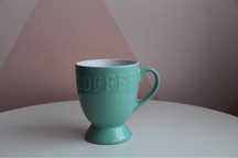 Kubek do kawy Empik miętowy z napisem Coffee