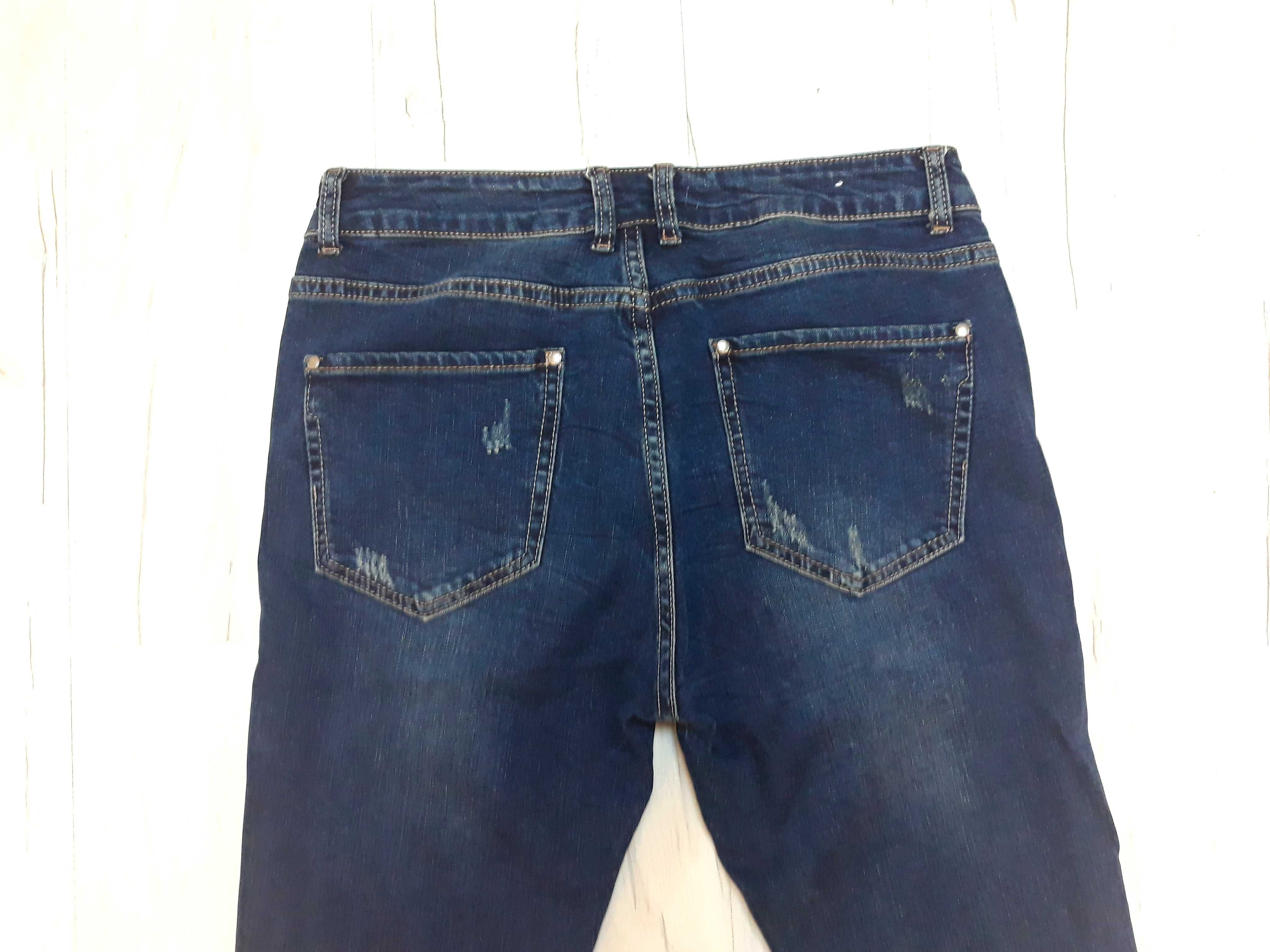 spodnie jeans z przetarciami  r.28