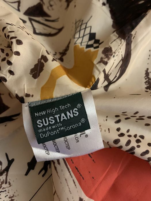 Пуховое пальто фіалетового кольору