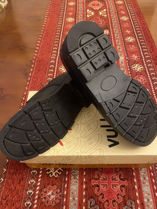 Sapatos de criança em couro