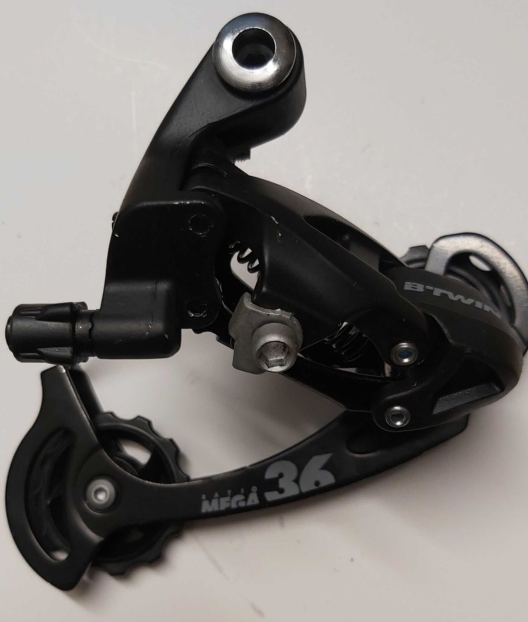 Przerzutka tylna ROCKRIDER BTWIN 7,8,9-rzędowa, solidna aluminiowa.