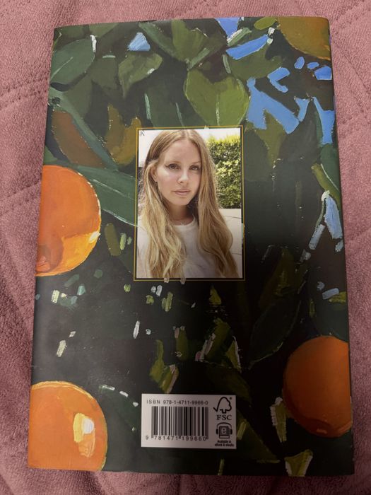 Lana del rey violet benf backwards over the grass