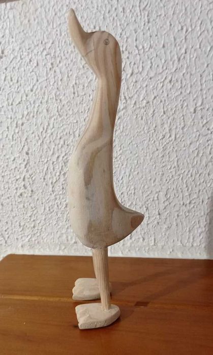 Conjunto de patos de madeira.