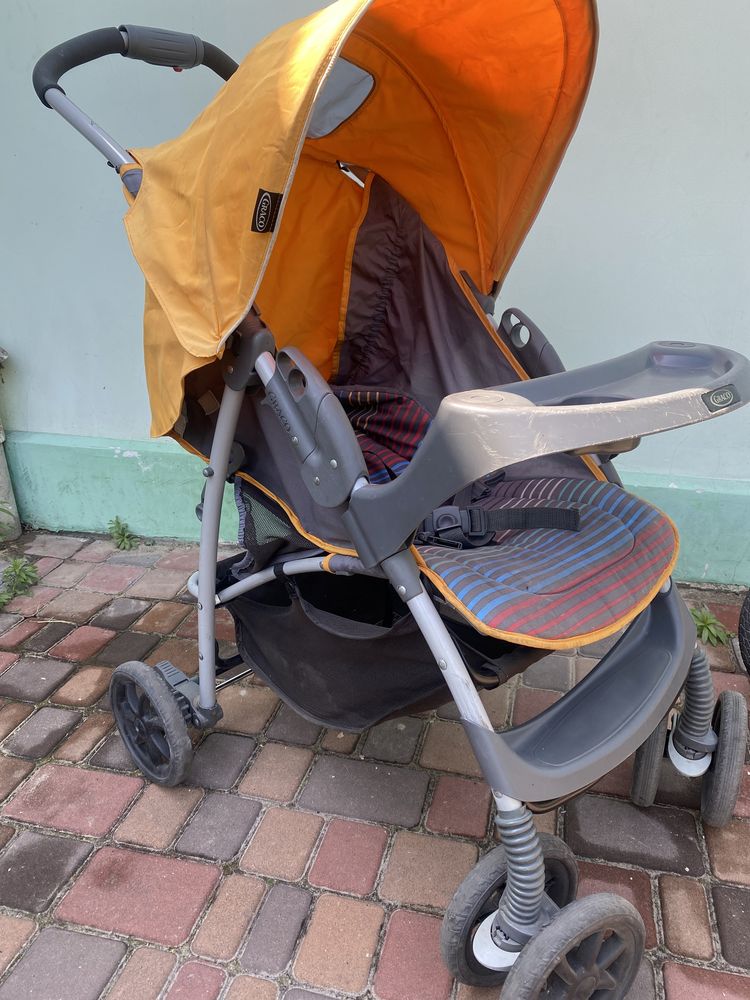 Продам Прогулочную  коляску  Graco Mirage Plus Jaffa Stripe, оранжевый