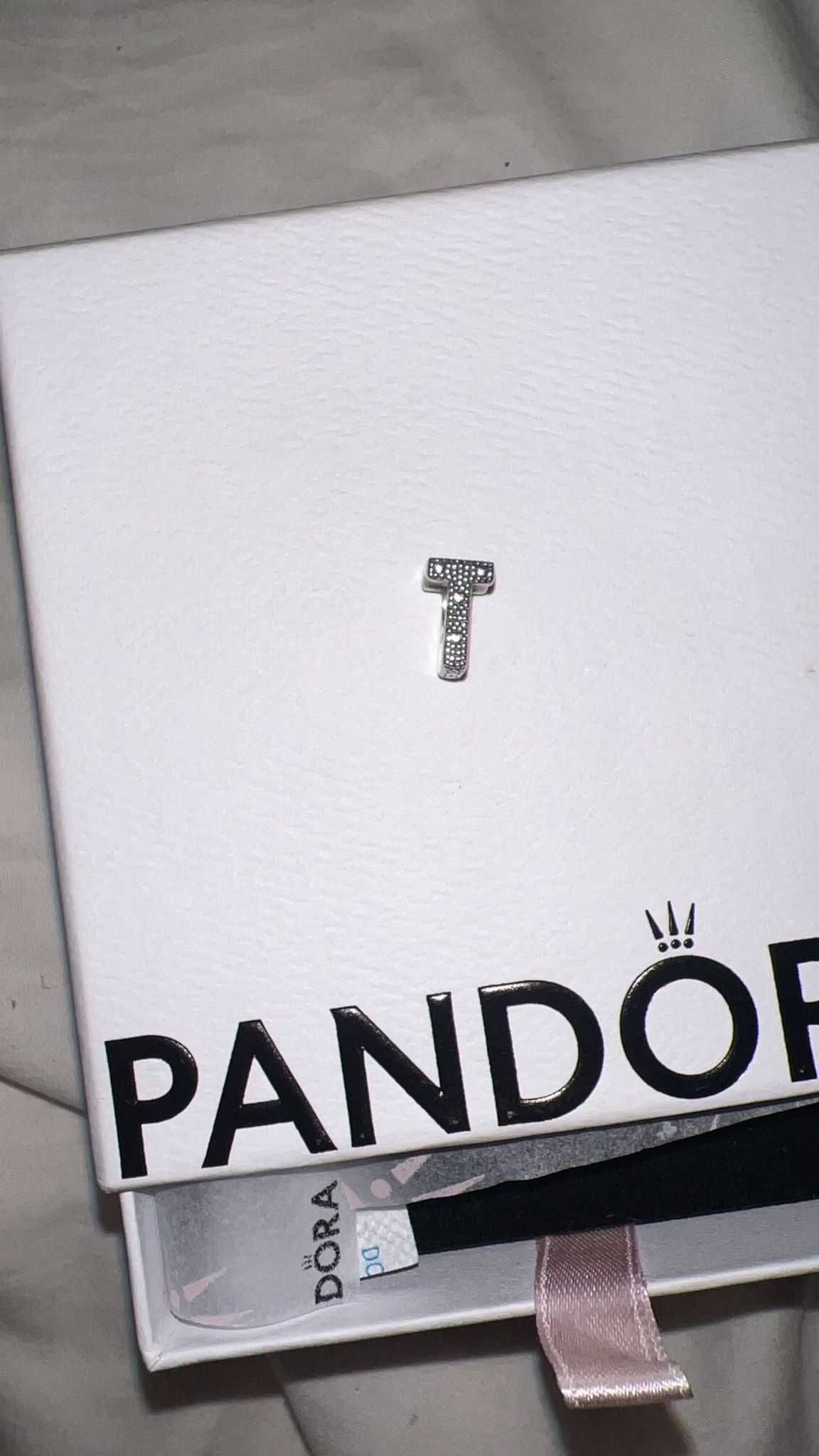 Pandora, Conta alfabeto T