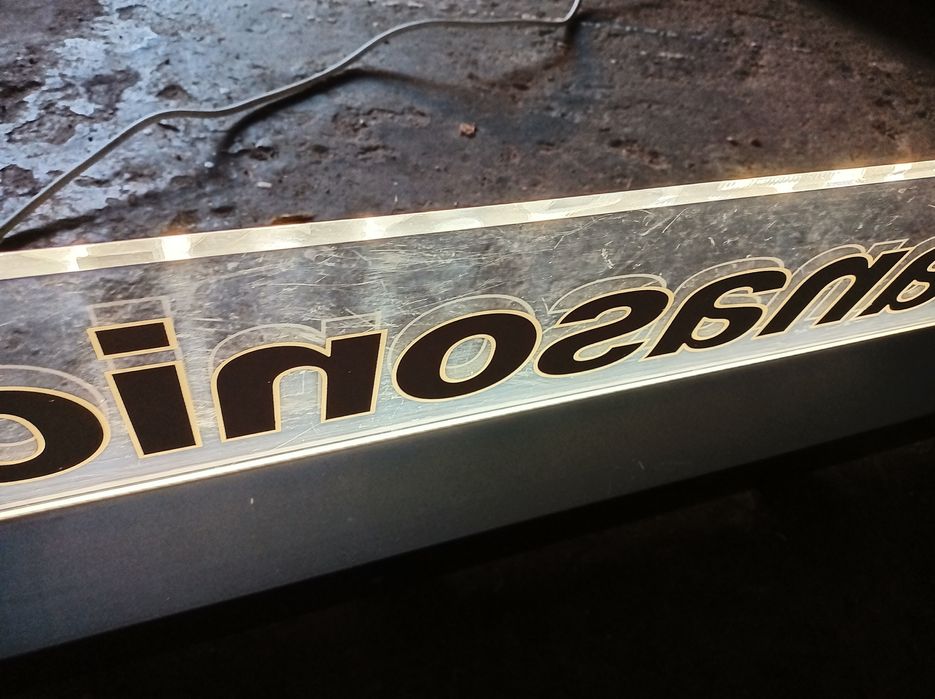 Oryginalny podświetlany szyld reklamowy Panasonic z plexi i podstawą