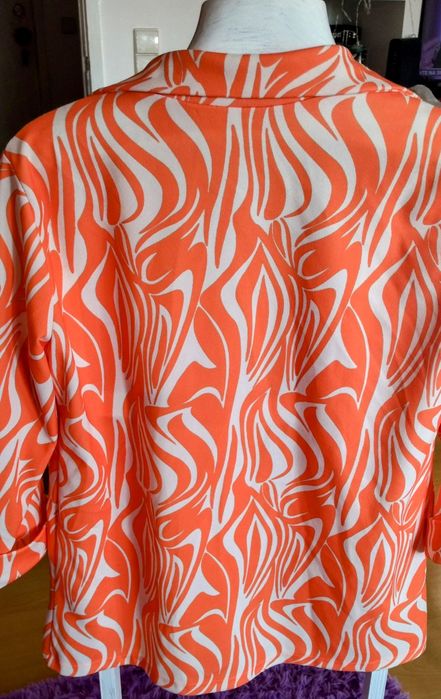 Blazer da pérola com meia manga.