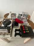 Playstation 3 slim z DJ HERO 2, padami Buzz, mikrofonami, PS move, gry