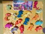 zestaw małych zabawek dinozaury stitch odblaski jojo magnesy kubek...