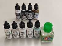 Conjunto de tintas Model Color e cola Tamiya para modelismo.