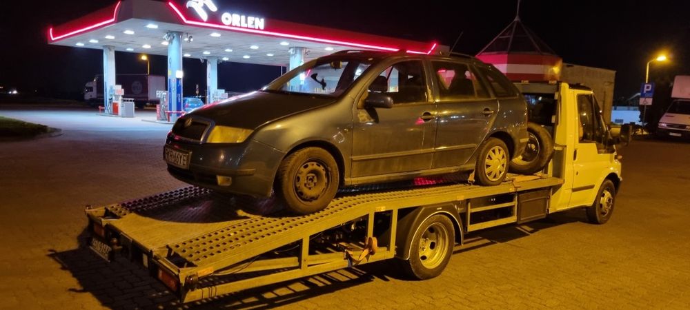 Pomoc drogowa. Usługi. Autolaweta. Transport aut