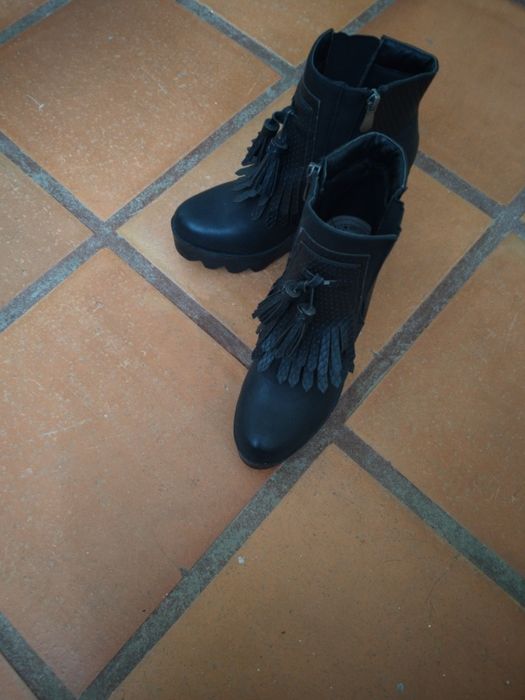 Botas com franjas