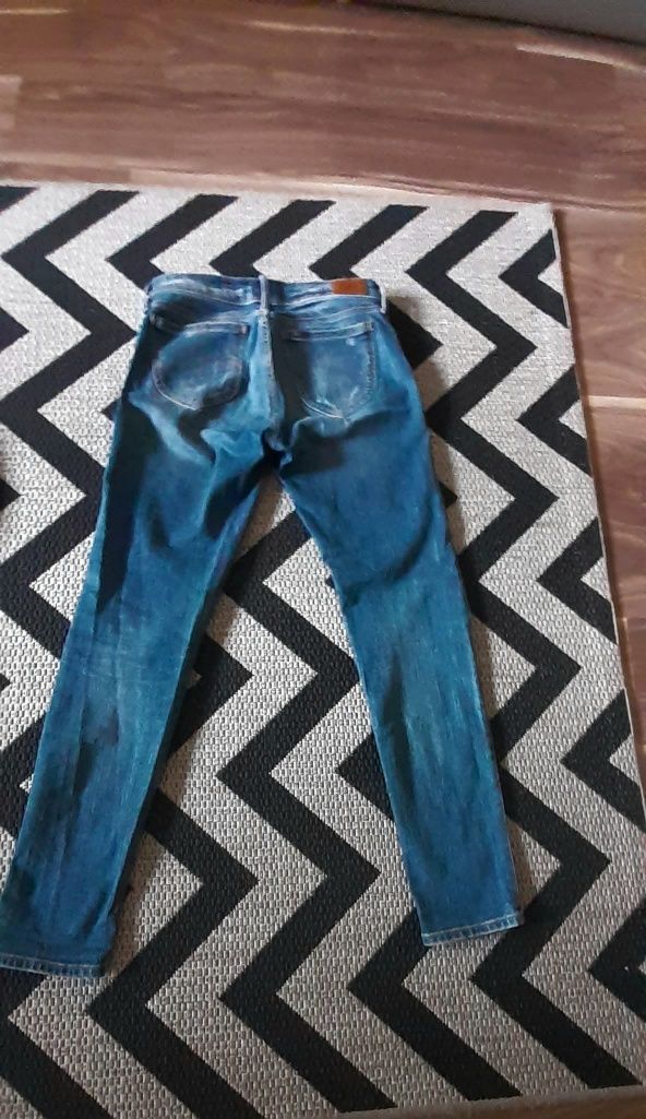 Lee spodnie jeans z przetarciami