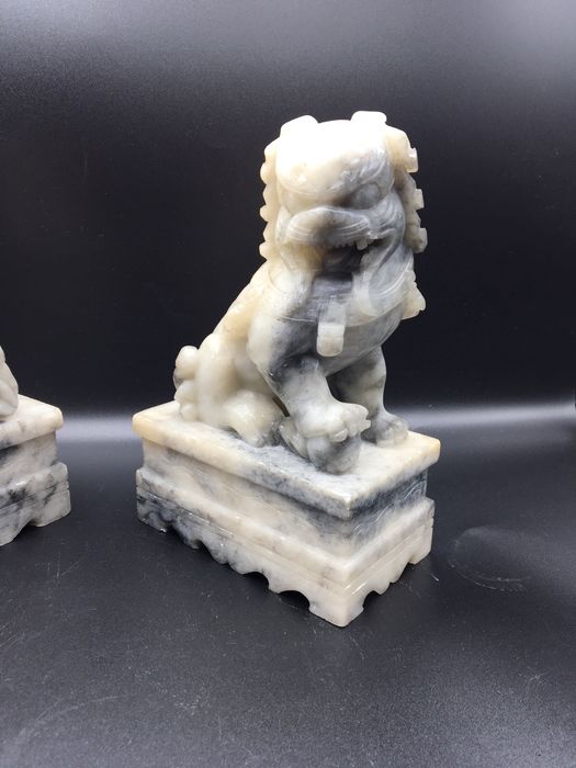 Caes foo orientais em pedra